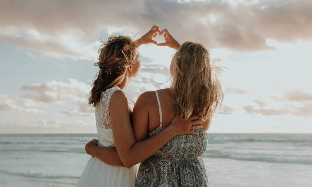A couple embracing at sunset on a Western Australian beach